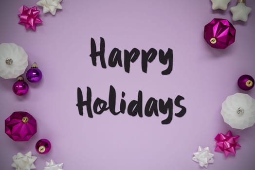 Christmas Card With English Text Happy Holidays. Purple Christmas Background With Romantic And Brilliant Decoration Like Balls.