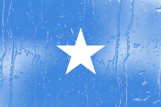 3D Flag of Somalia on a glass with water drop background.