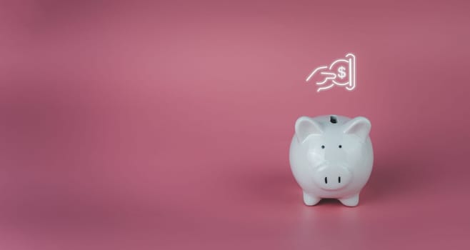 white piggy bank on a pink background. Savings and investment concepts.