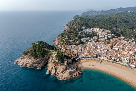 the popular Village of Tossa de Mar at Costa Brava,Catalonia,mediterranean Sea,Spain. Aerial view castle and lighthouse detail.