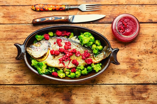 Baked whole fish dorado in fruit marinade,fish dish