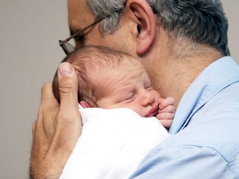 Father and a baby on the first day in the hospital