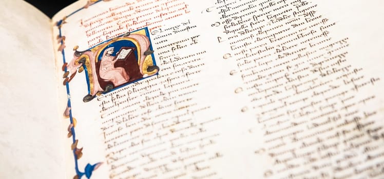 FLORENCE, ITALY - circa July 2021. Antique manuscript sheet from Dante Divine Comedy, 16th Century copy.