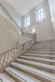 TURIN, ITALY - CIRCA MAY 2021: luxury staircase made of marble in an antique Italian palace