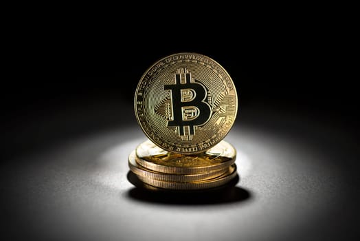 Bitcoin gold coin in black background. Virtual cryptocurrency concept.