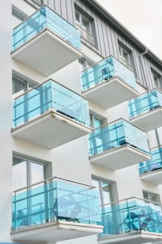Facade of a house with blue balconies in the center of Swinoujscie in Poland
