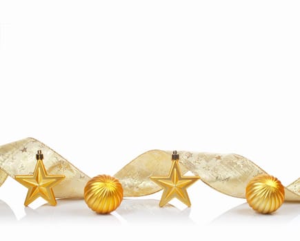 A golden Christmas ornaments, reflected on white background with space for text