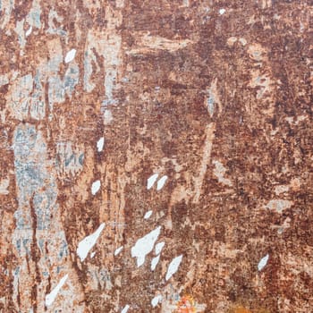 Rusted metal background, with torn pieces of paper.