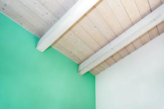 Wooden ceiling with exposed beams. Interior wooden roof with exposed beams.