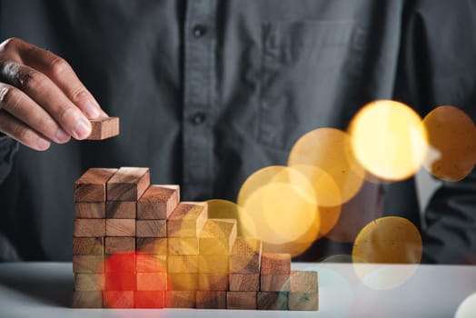Business hand arranging put wooden block stacking step stair growth success process, financial risk management and strategic plan and business challenge planning concept, prevent collapse or crash