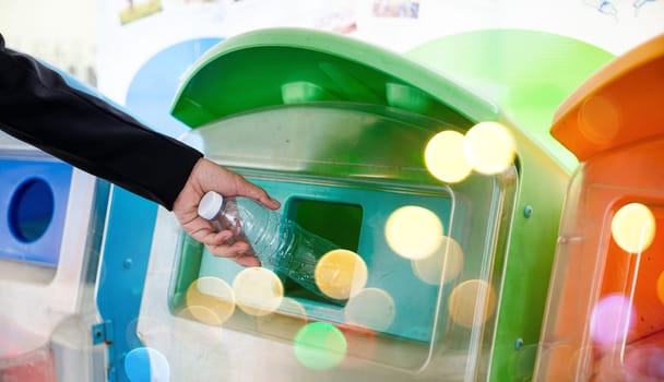 World Environment Day concept. Business woman throwing empty plastic bottle water into recycle garbage trash or bin, Waste management environmental recycling concept