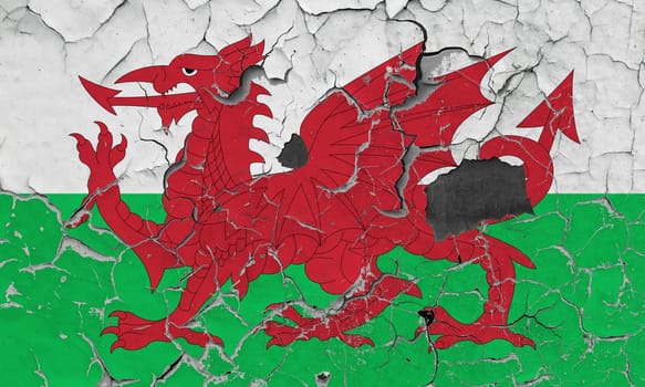 3D Flag of Wales on an old stone wall background.