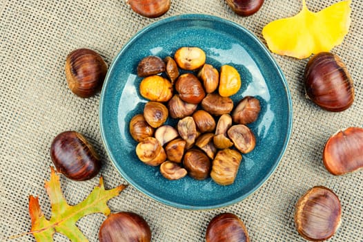 Peeled roasted chestnuts, appetizing dessert. Caramelized roasted chestnuts.Top view