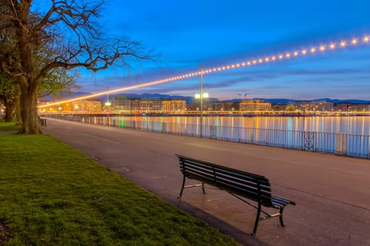 Bench at the english garden promenade near the lake by night, Geneva, Switzerland, HDR