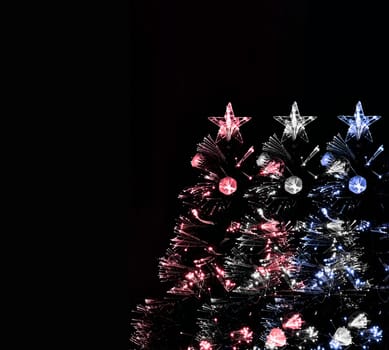 Red, white and blue Christmas Trees on black background