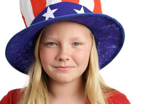 Portrait of a beautiful young American girl wearing a patriotic hat.  Isolated on white.
