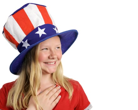 A beautiful young girl dressed patriotically and saying the Pledge of Allegiance.  White background with room for text.