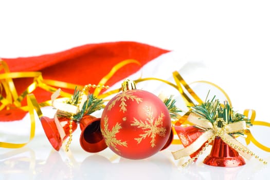 Red Christmas balls and hand bells isolated on white background