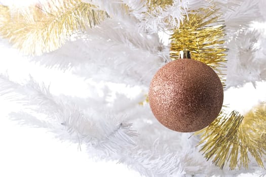 Ornaments on a white Christmas tree.