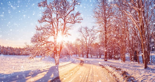 Beautiful view of the sunrise in the morning on the country snowy road. Scenery landscape.