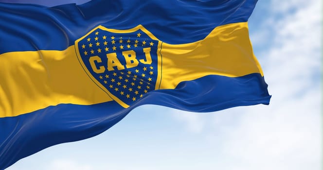 Buenos Aires, AR, Oct. 2022: The Boca Juniors flag waving in the wind. Boca Juniors is an Argentine sports club based in Buenos Aires