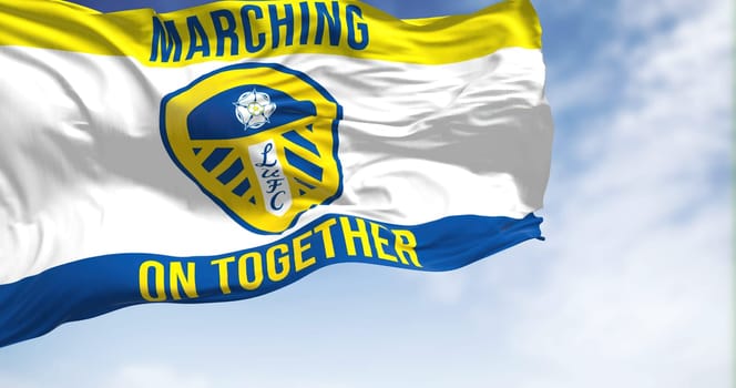 Leeds, UK, Oct. 2022: The Leeds United flag waving in the wind. Leeds United Football Club is an English football club based in Leeds