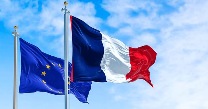 the flags of France and the European Union waving in the wind on a sunny day. Democracy and politics. European country.