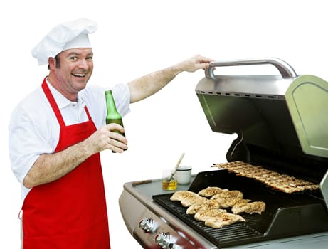 A happy smiling cook making dinner on his barbecue grill.  Isolated on white.