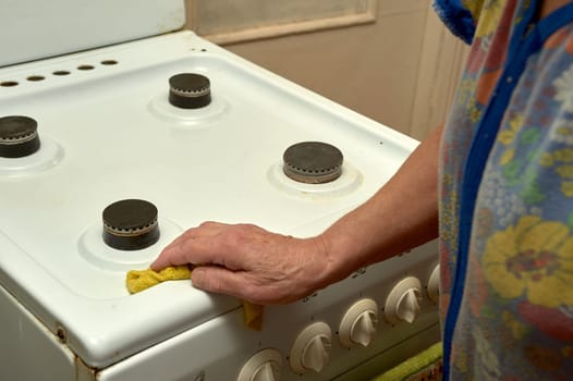 wet cleaning of the gas stove. High quality photo