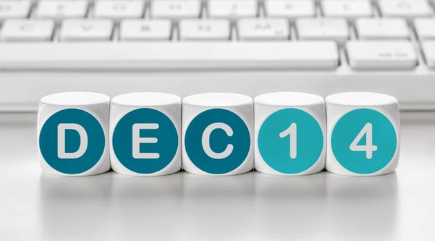 Letter dice in front of a keyboard - December 14