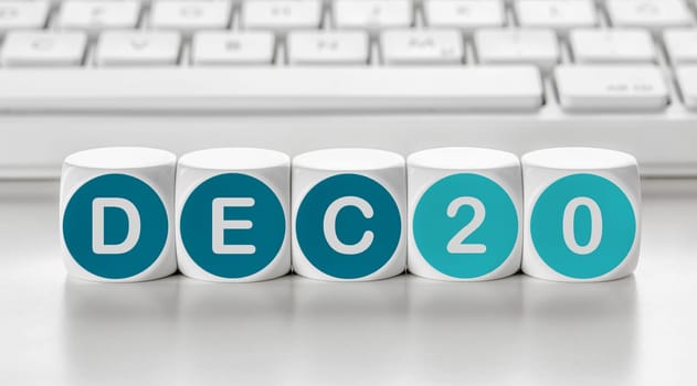 Letter dice in front of a keyboard - December 20