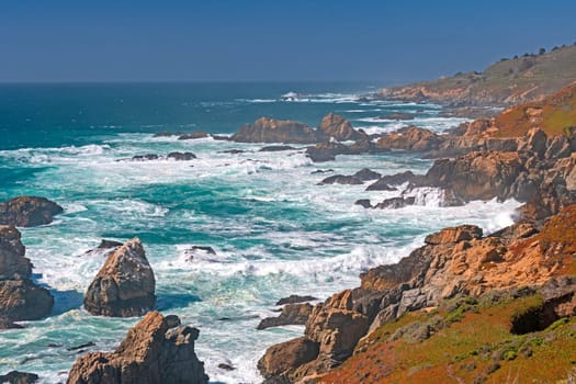 Sea Foam Amongst the Rocks on a Hazy Coast at Andrew Molera State Park in California