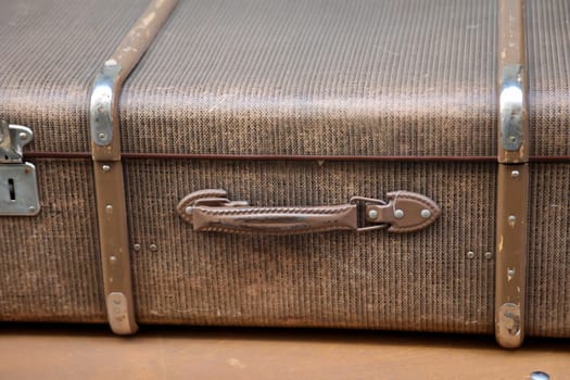 Details of an old suitcase as it was used 50 years ago.