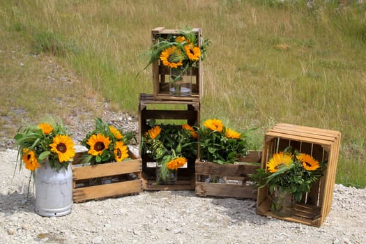 A festive decoration with beautiful yellow sunflowers.