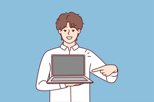 Smiling young man point at modern laptop with mockup screen. Happy male show contemporary computer. Tech and gadget application. Vector illustration.