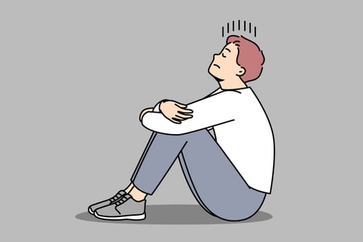 Unhappy young man sit on floor suffer from loneliness and repetitive thoughts. Stressed male struggle with depression or anxiety. Vector illustration.