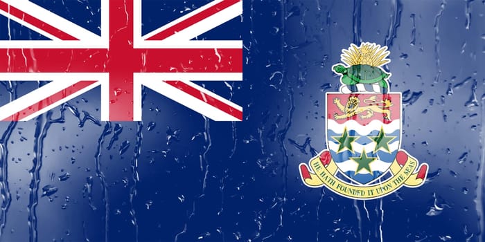 3D Flag of Cayman Islands on a glass with water drop background.