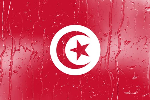 3D Flag of Tunisia on a glass with water drop background.