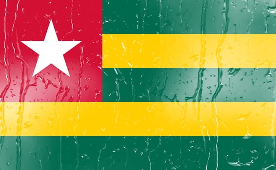 3D Flag of Togo on a glass with water drop background.