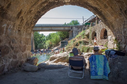 Losar, Spain - August 23th, 2022: Cuartos natural swimming pool. Crystal-clear waters spot in the heart of La Vera County, Caceres, Extremadura, Spain
