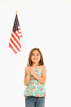 Girl holding American flag against white background.