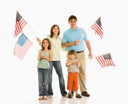 Hispanic family holding American flags.