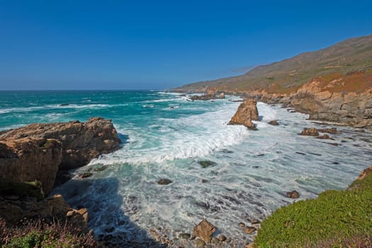 Wave Crashing into a Horsehoe Cove in Andrew Molera State Park in California