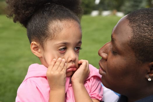 Father and child having fun in a park
