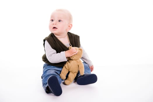 curious little boy over white background