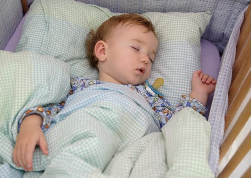 A baby is sleeping at the morning