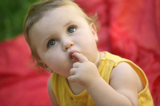 Cute happy one year old baby looking up