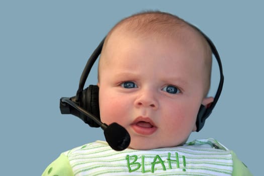 Baby with a headset on a blue background