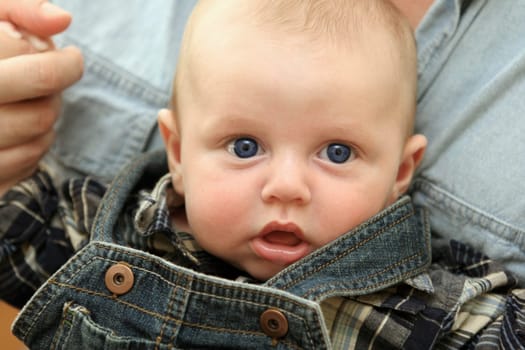 Close-up portrait of a cute baby boy .