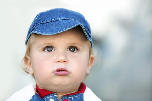 Cute happy 14 month old baby in a hat